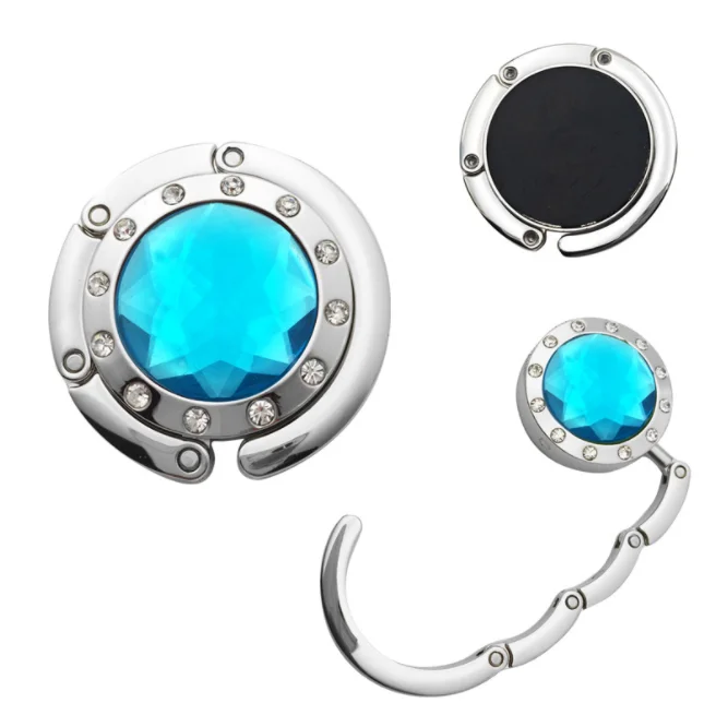

Cheap Custom Logo Lady Purse Bag Hook Foldable Acrylic Zinc Alloy Restaurant Table Crystal Handbag Key Stand Holder