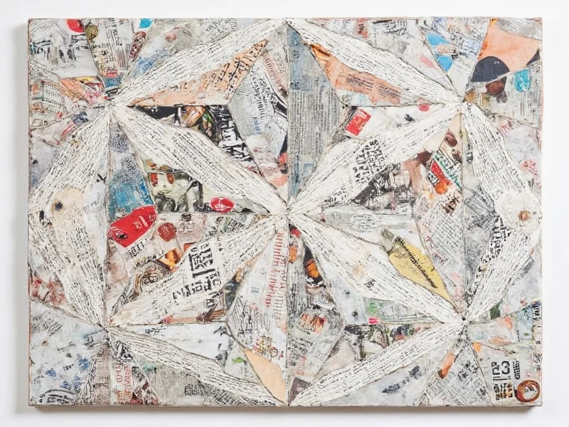 Geometric wall art made from recycled magazine pages