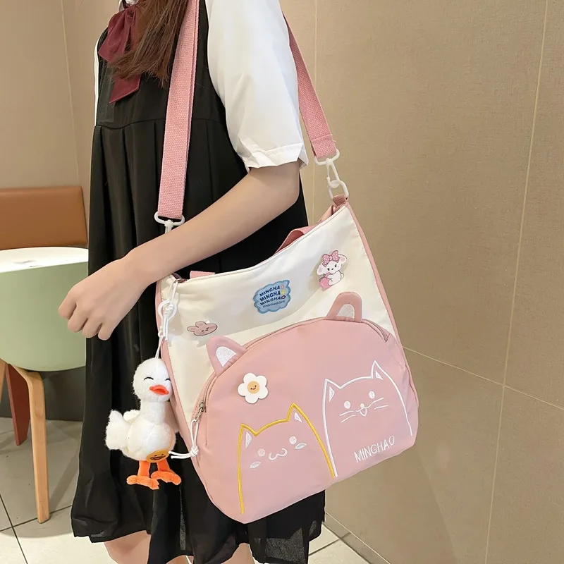 

2023 New Korean Girls' Shoulder Bag Fashion Cartoon Cat Design Large Capacity Student's Canvas Bag Messenger Bag