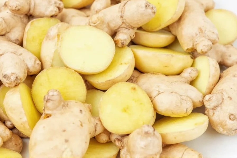 Close-up view of fresh ginger root showing knobby texture and tan skin with visible growth nodes