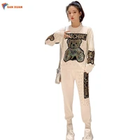 

Wholesale Autumn Latest Design Sexy Women Fashion Beaded Knitted Long Sleeve Round Collar Top And Long Pants Two Piece Set