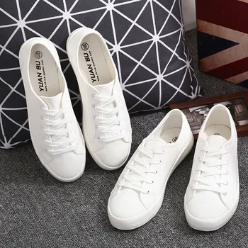 white lace up canvas sneakers