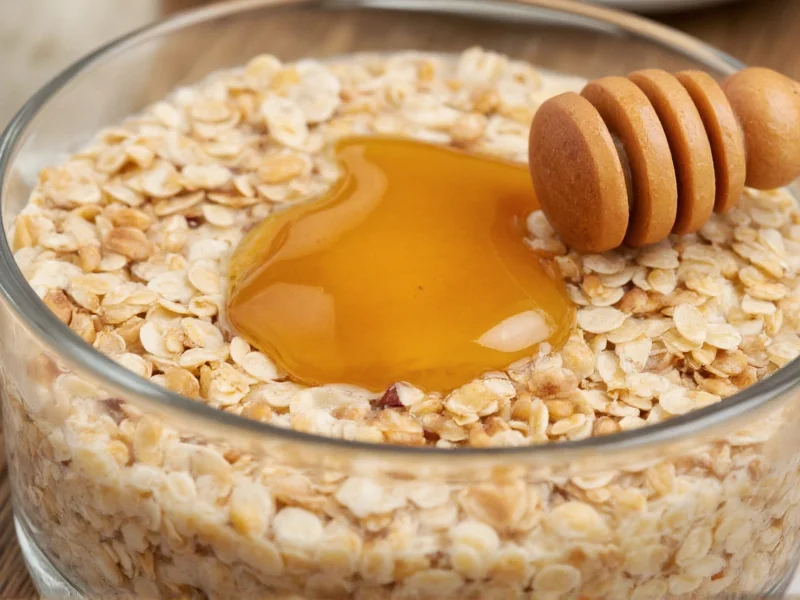 Close-up of oatmeal and honey in glass bowl