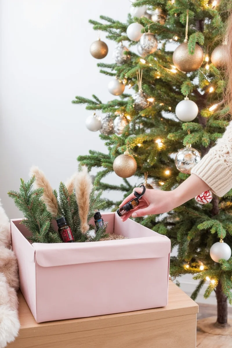Cotton balls with essential oils tucked into a Christmas tree