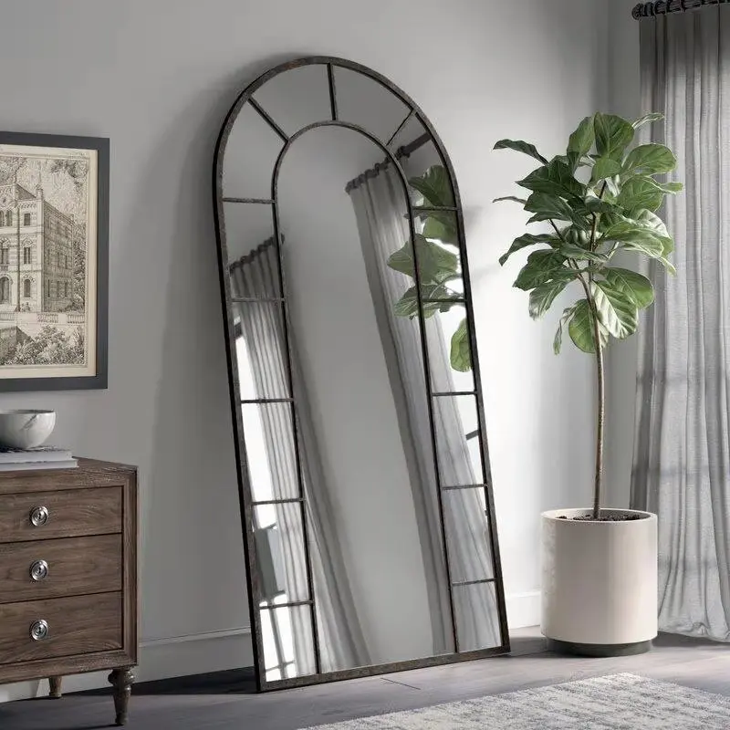 

large arched full-length metal floor standing dressing mirror