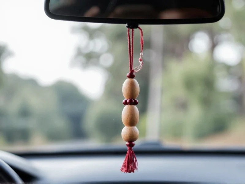 Handmade wooden bead car air freshener hanging from rearview mirror