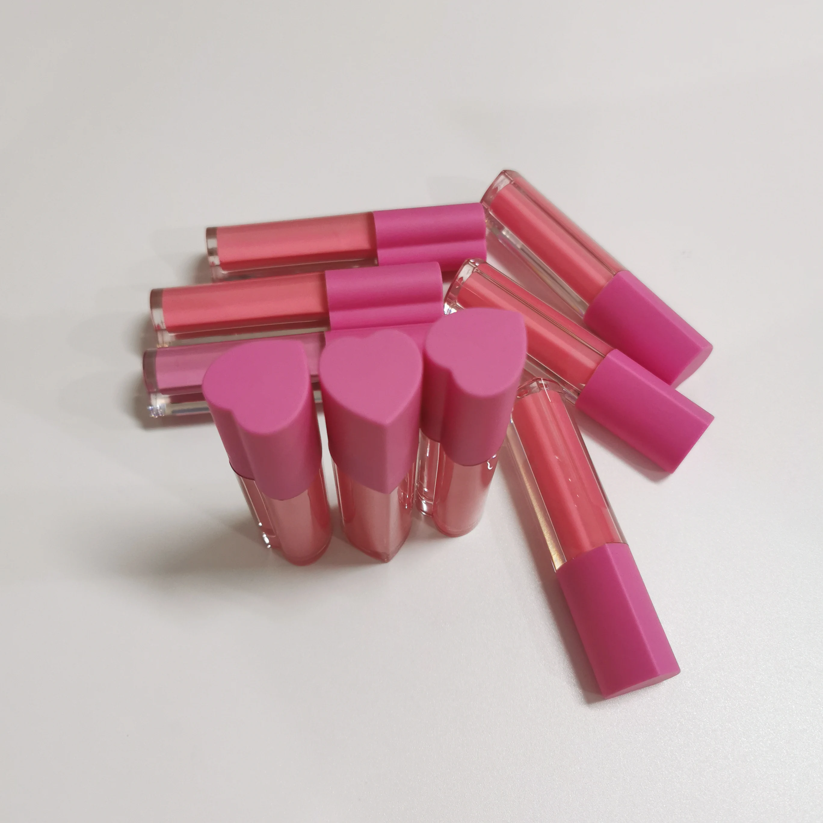 

Vendor custom new heart shaped lip gloss tubes packaging private label plumping glossy nude gloss, 29 colors