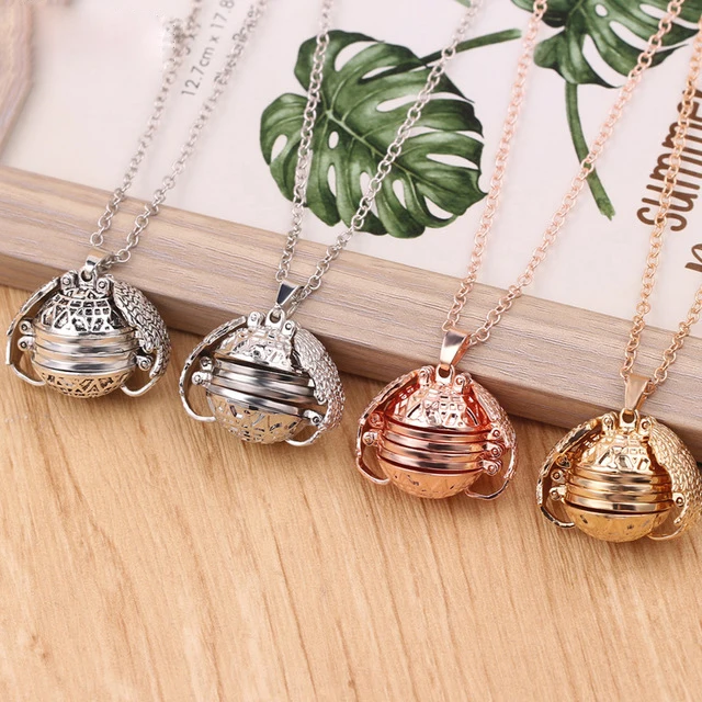 

Hot Selling Expanding Ball Pendant Necklace Memory Floating Angel Wings Box Magic 4 Photo Box Locket Photo Necklace, As picture show
