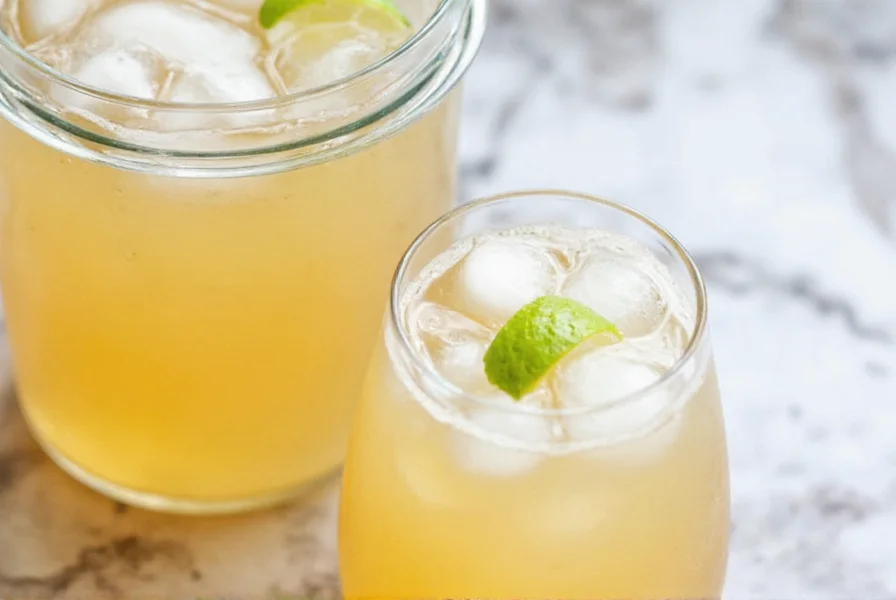 Fresh ginger root, sugar, lemons and glass bottles arranged for homemade ginger ale preparation