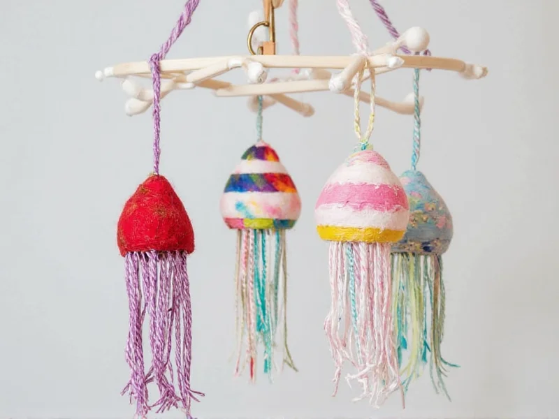 Colorful jellyfish mobile made from textile scraps and embroidery hoops