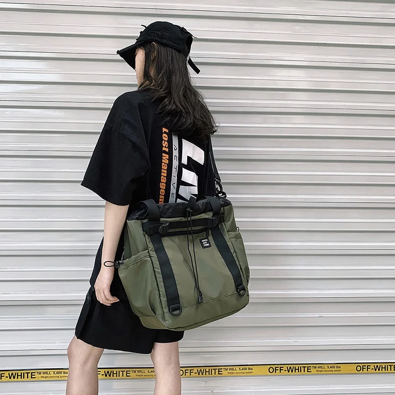 

Hot Selling Causal Black Waterproof Custom Logo Drawstring Adjustable Shoulder Strap Sports Travel Bags with Soft Handle