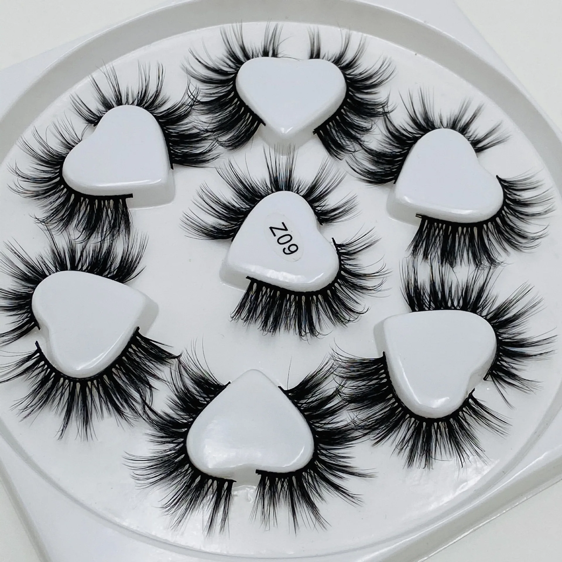 

Top Selling Softer Natural Chemical Fiber Heart Shaped Eyelash 7 Pairs A Set Eyelash Box Logo Packaging Custom, Natural black