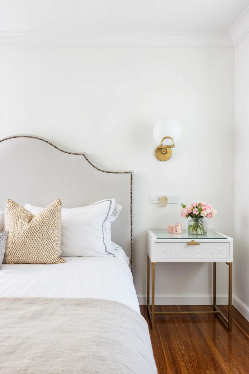 Family bedroom with perfectly placed wall sconces and cozy ambiance