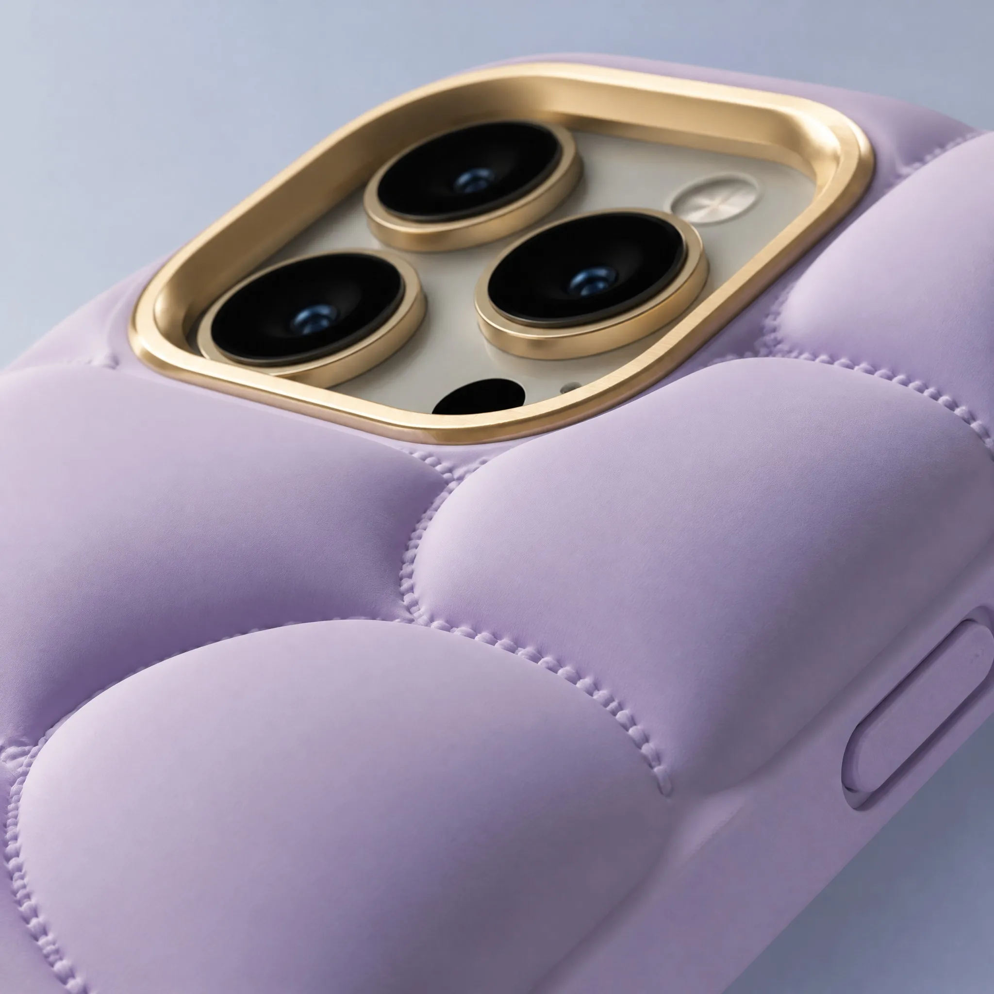 4K Macro Close-up of Anodized Aluminum Camera Bezel Lip and Quilted Stitch Grooves on Lilac Puffer Phone Case