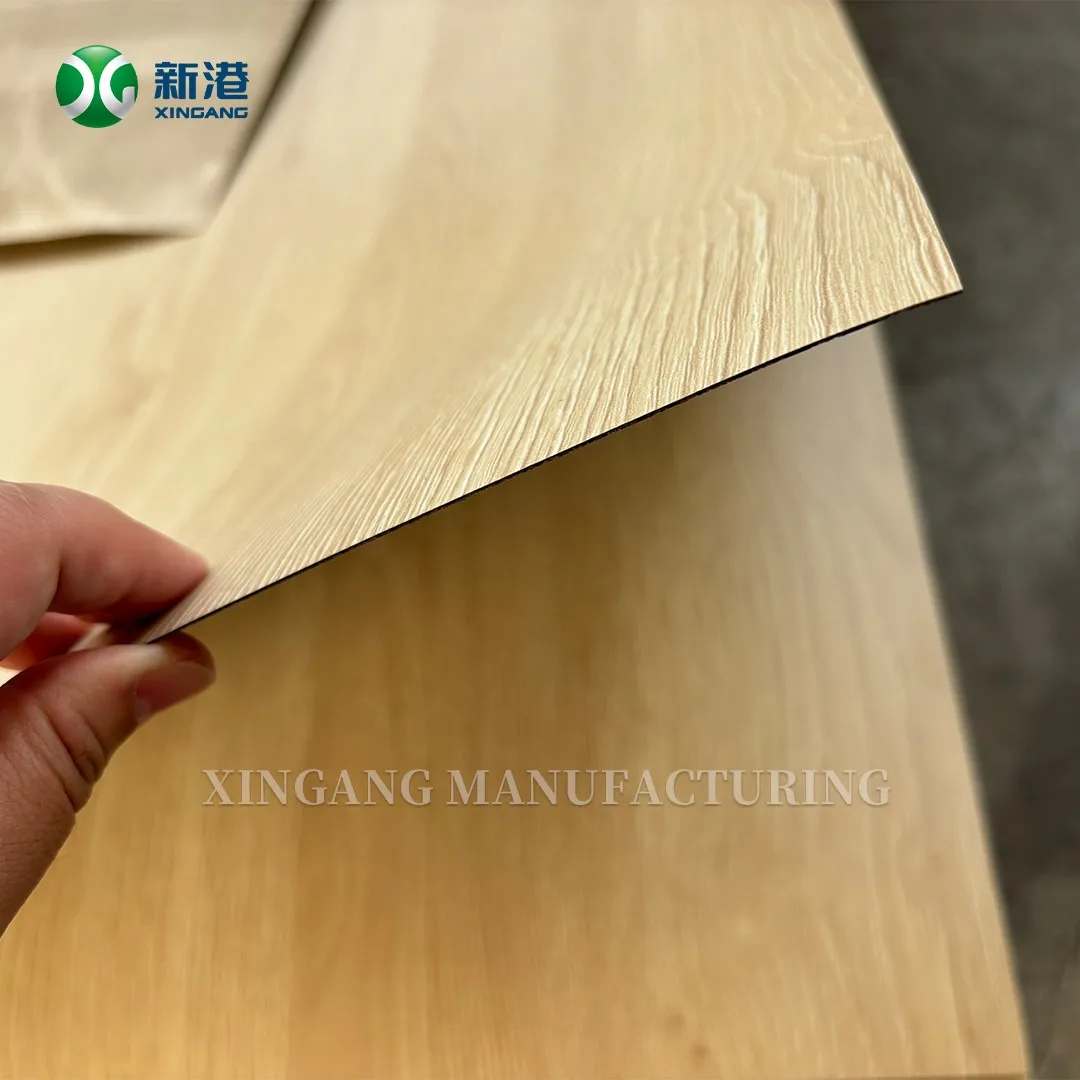 0.7mm HPL laminate sheet flexing between a hand and a board surface