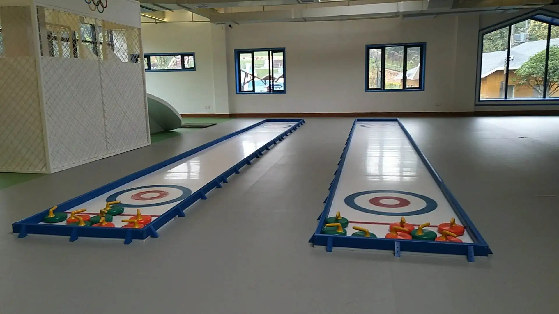 portable curling synthetic ice rink with curling stones