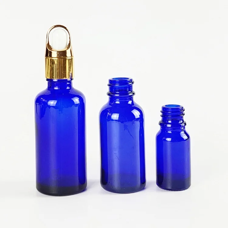 

Blue 10ml 30ml 50ml Essential Oil glass bottle with Gold flower basket cover Lid dropper