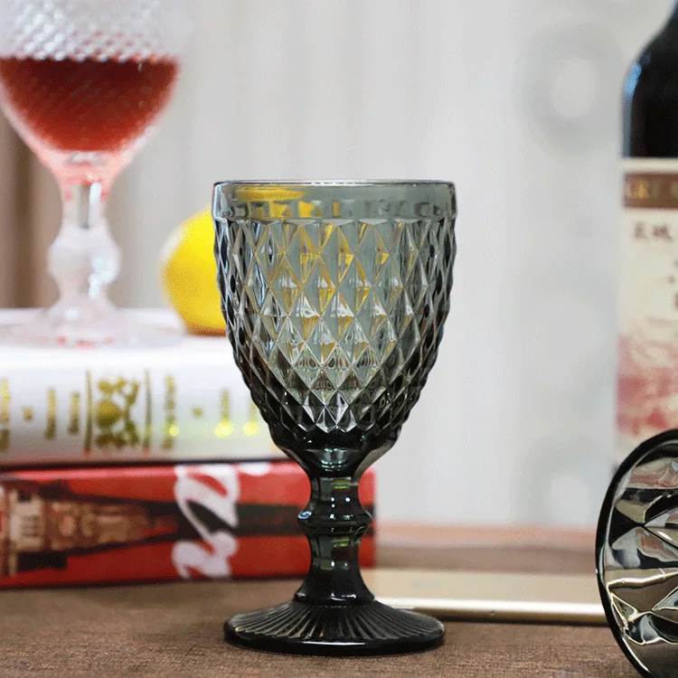 

Wholesale Handmade Custom Colored Wine Glass Embossed Goblet Wine Glass Engraved Pattern Pressed Wine Glass, Customized color acceptable