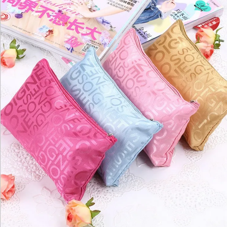 

Alphabet printing travel carry waterproof Makeup toiletry fashion cosmetic storage bag