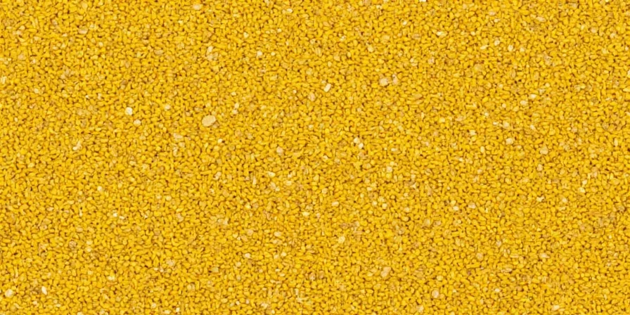 Close-up of yellow mustard seeds on a wooden surface