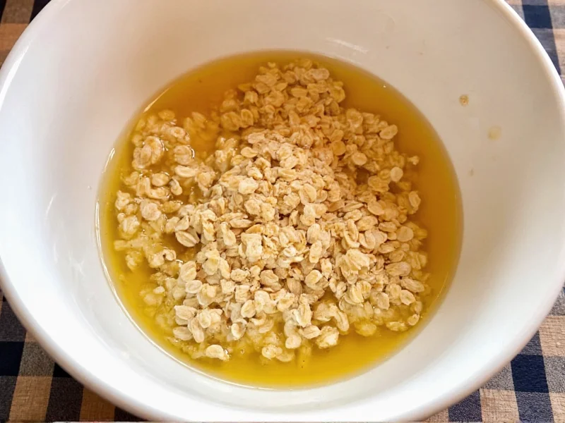 Oatmeal and honey mixture in ceramic bowl
