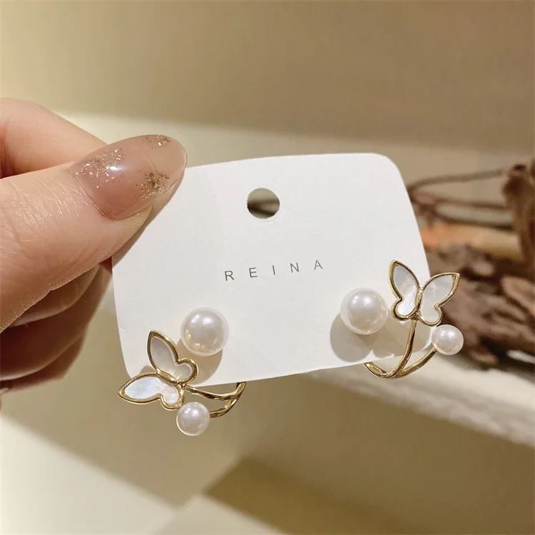 

Pendientes De Perlas Korean Style Butterfly White Enamel Earrings Temperament Women Butterfly Stud Earrings