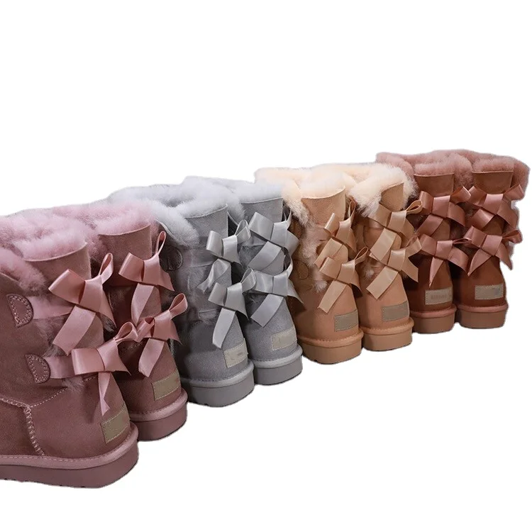 

2021 new sheepskin wool waterproof snow boots middle tube double ribbon bow warm women's cotton shoes