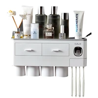 

2019 Latest styles toothbrush rack PP plastic bathroom wall automatic toothpaste dispenser toothpaste toothbrush holder set