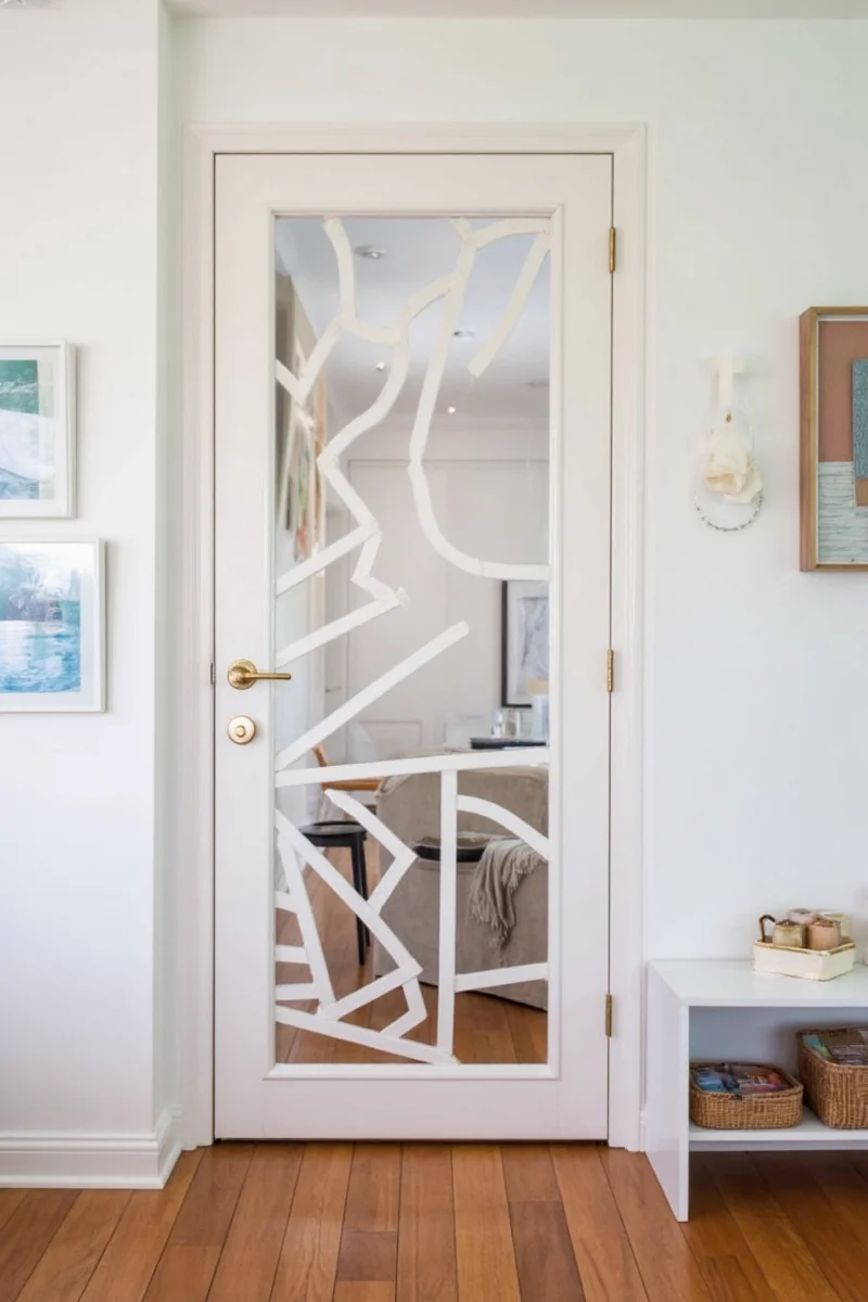 Magnetic hooks installed on a wooden door frame