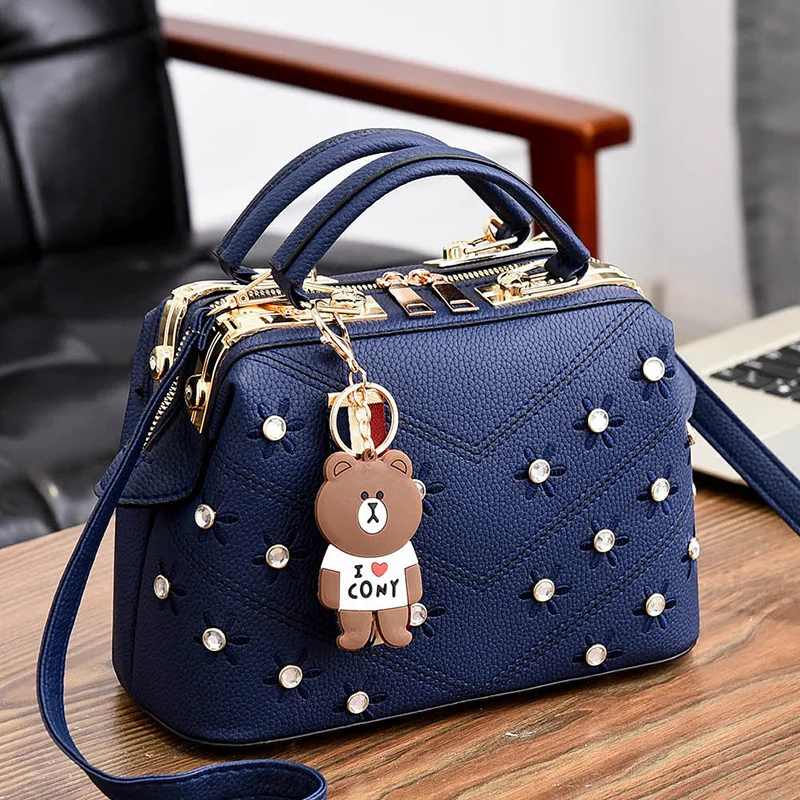 

PU leather handbags retro embroidery handbags Korean version of the bear pendant steel armor bag messenger shoulder bag