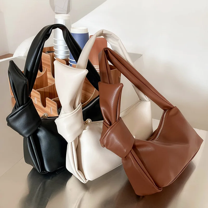 

Wholesale Pure Color Bow Knot Shoulder Bag Pearl Zip Soft Leather Messenger Bag Luxury Underarm Hand Bags Dumpling Purses