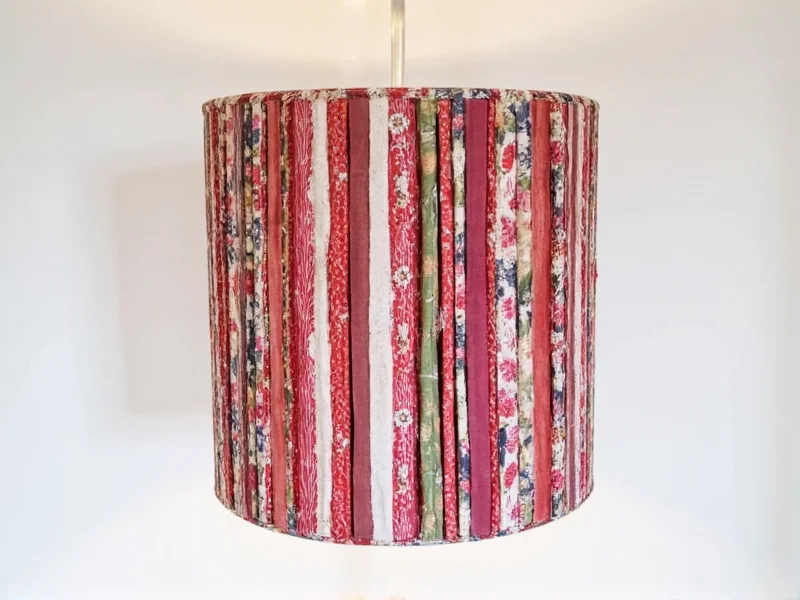 Handmade drum lamp shade using recycled fabric strips