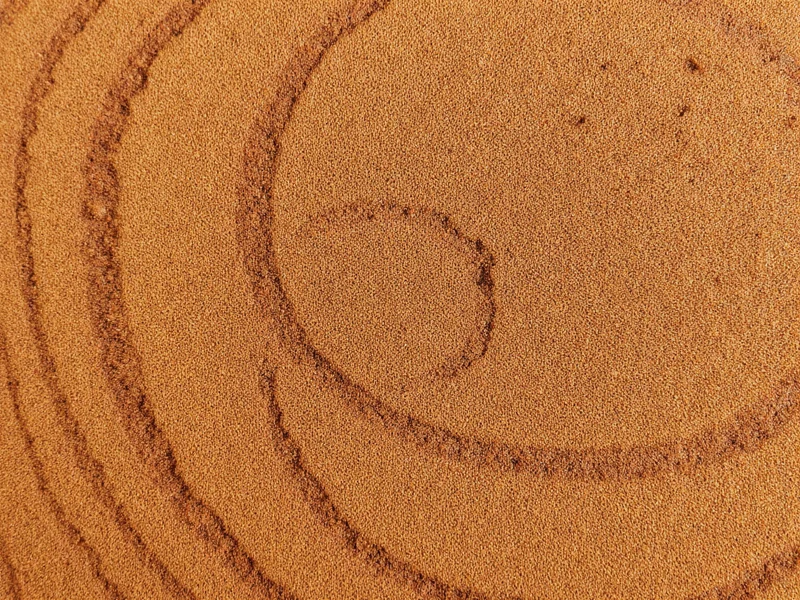 Close-up of reclaimed wood showing grain revealed through grinding