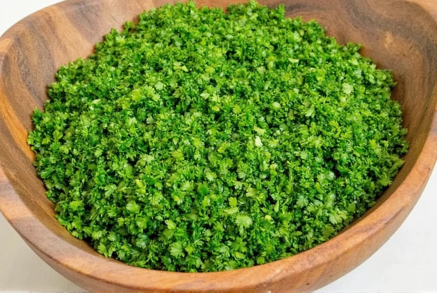 Cook stirring soup with dried parsley being added
