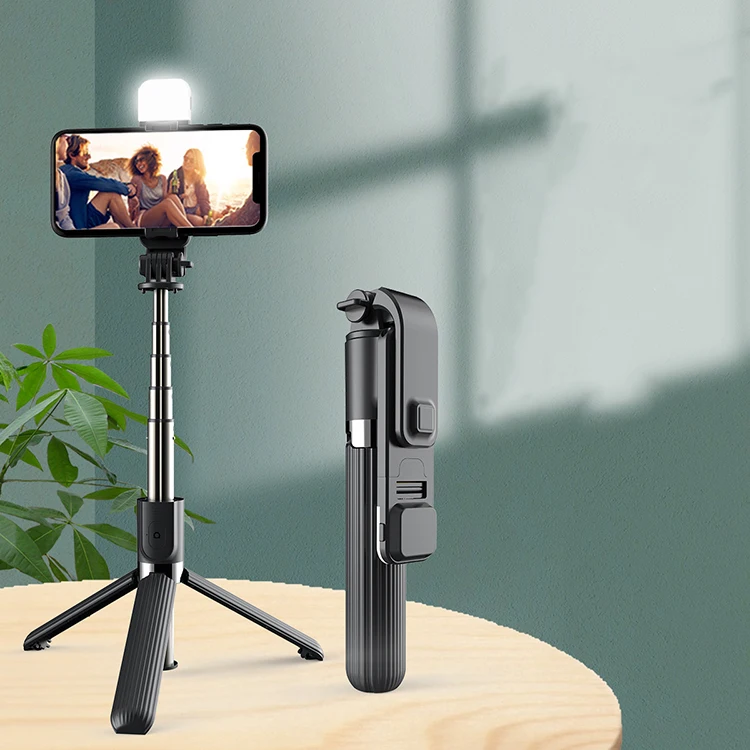 

New 3 In 1 Mini Handheld Telescopic wireless selfie stick tripod With fill light