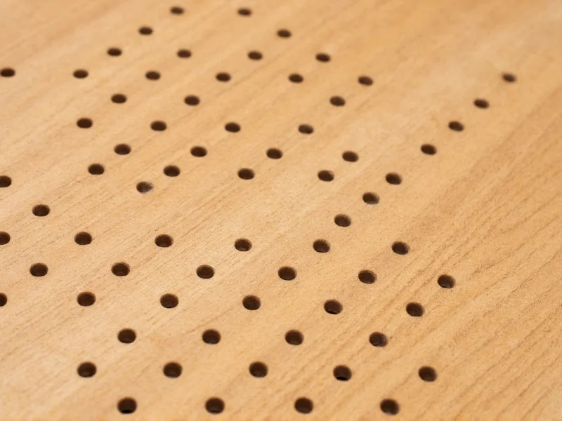 Close-up of peg grid layout on wooden plinko board