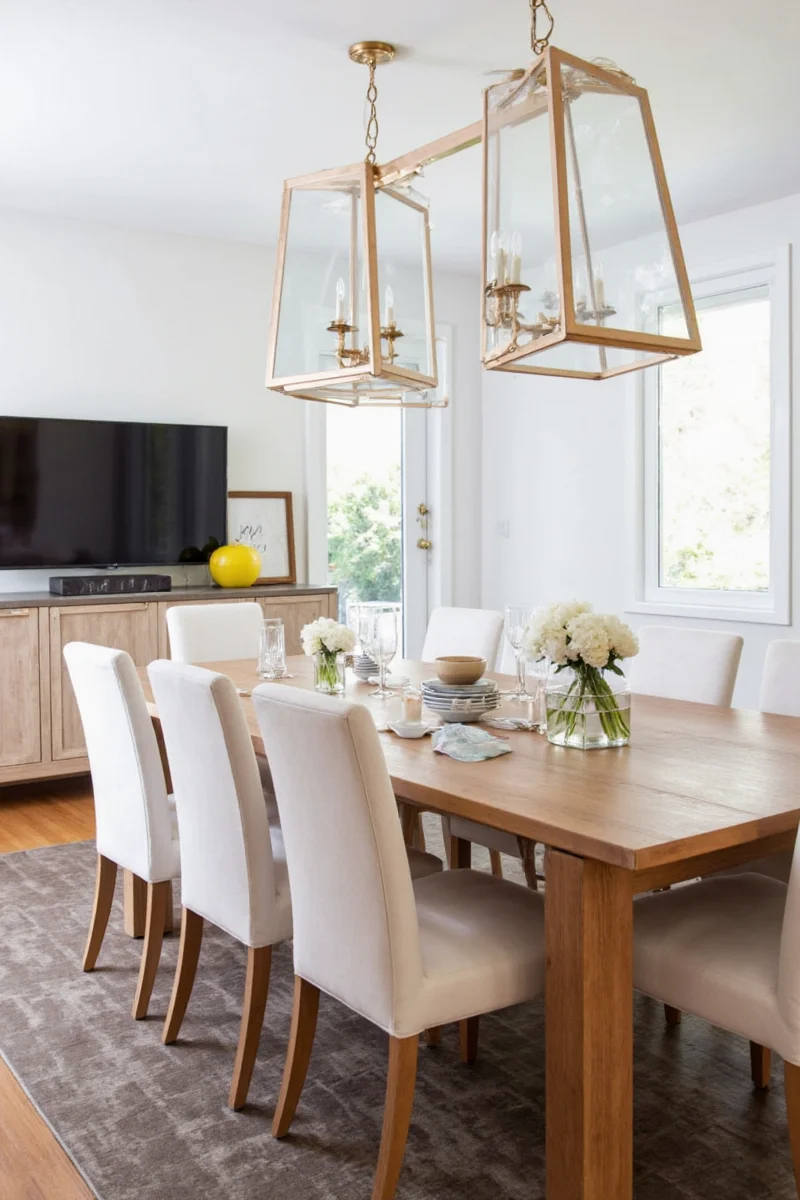 Kid-friendly dining table setup with plastic glasses and wooden bowl