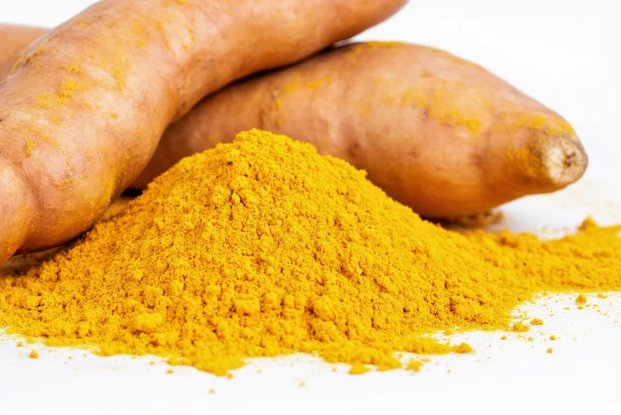 Close-up view of fresh turmeric root next to ground turmeric powder showing the vibrant yellow color