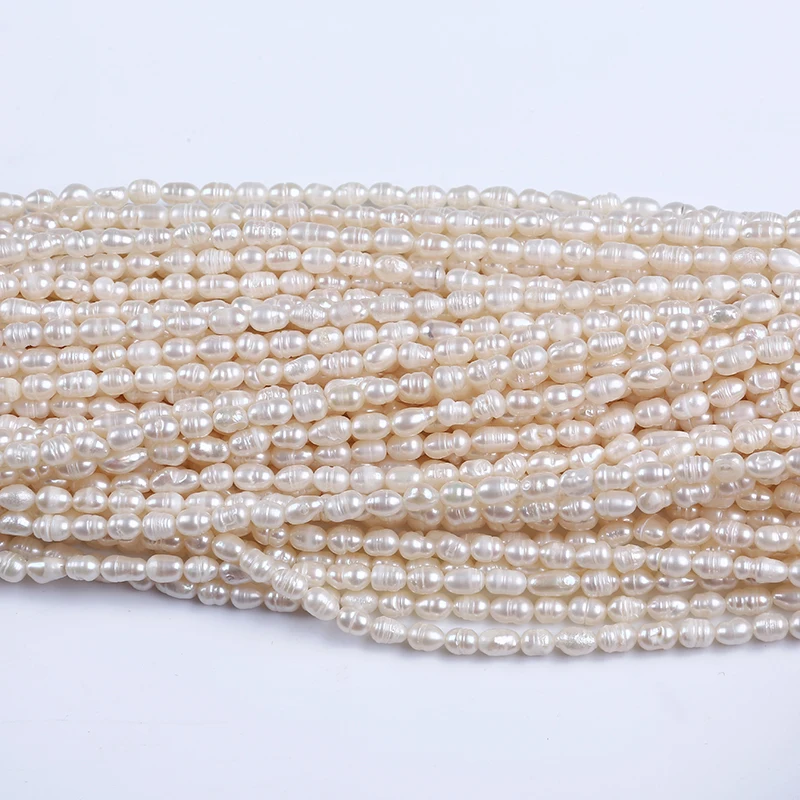 

wholesale freshwater bulk freshwater beads rice shape strand pearl, White