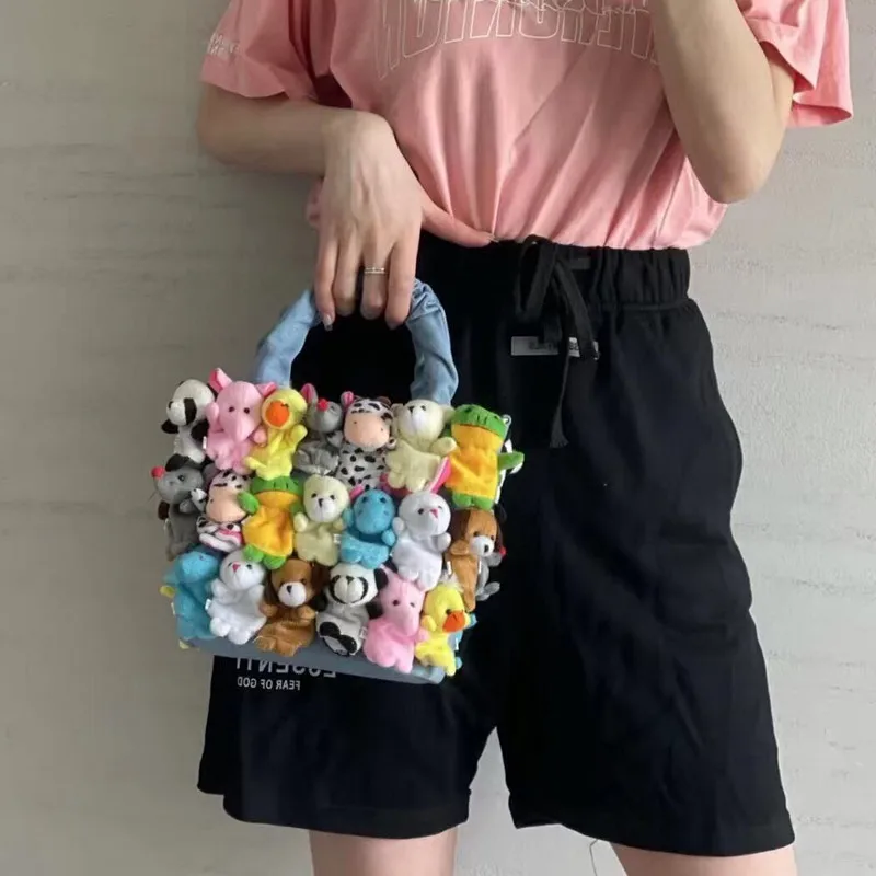 

Fashionable cute doll portable messenger handbag 2021 new hot sale bag, Customized color