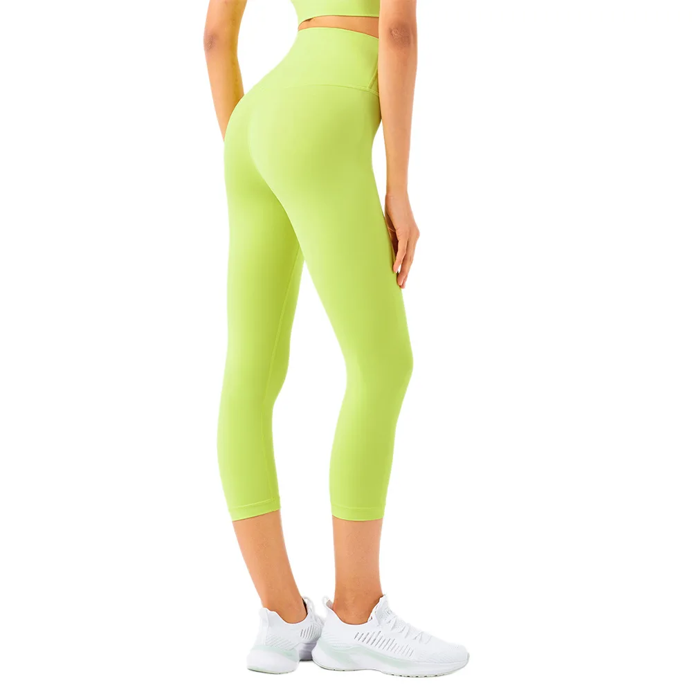 

European and American ladies 2021 new color high waist Peach Hip seamless tights nude feel pocket sports yoga pants Capri pants