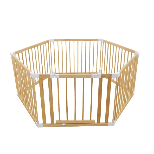 white wooden playpen