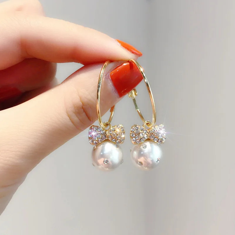 

Korean Pearls Hoop Earrings for Women Jewelry Shining Bowknot Pearls Gold Lovely Female Earrings (KER589), Same as the picture