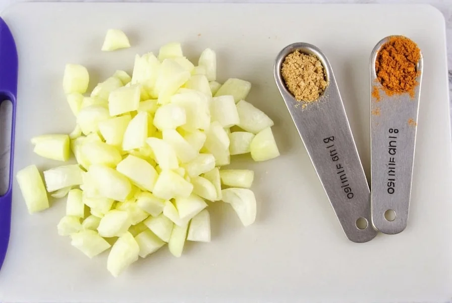 Fresh yellow onions chopped on cutting board next to measuring spoons showing onion powder substitution ratio
