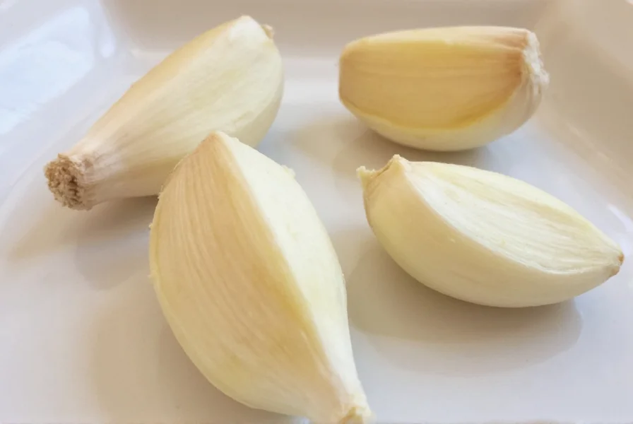 Chef measuring minced garlic into a spoon for precise recipe measurement