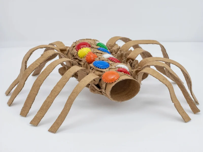 Recycled spider craft made from cardboard tubes and bottle caps