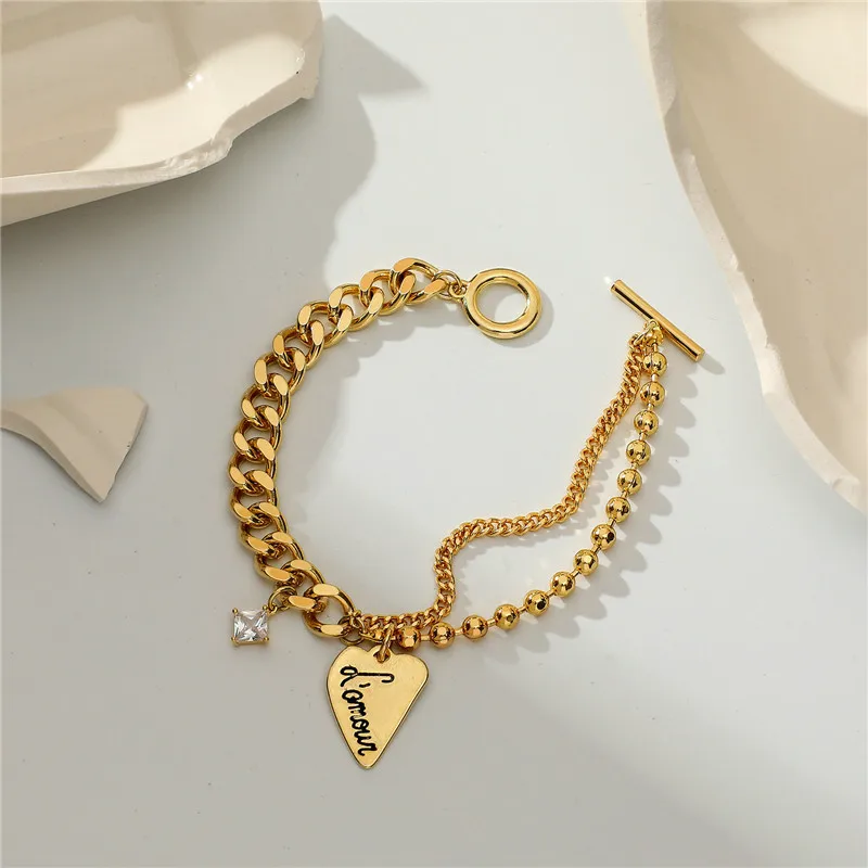 

Hongtong 14K Gold Plated Cuban Chain 8mm Round Bead Chain Square Zircon Pendant Letter Carved Heart Bracelets, Picture