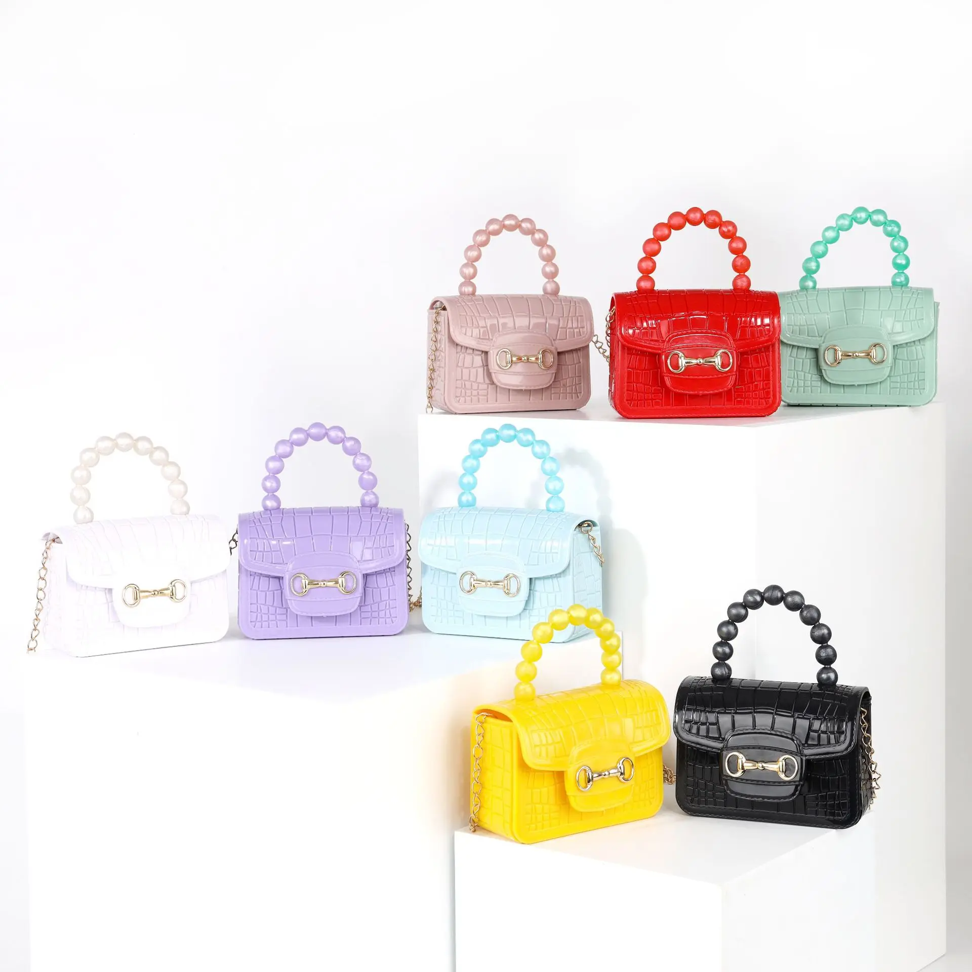 

2022 pearl color magnetic button silicone jelly net red cute mini hand bag