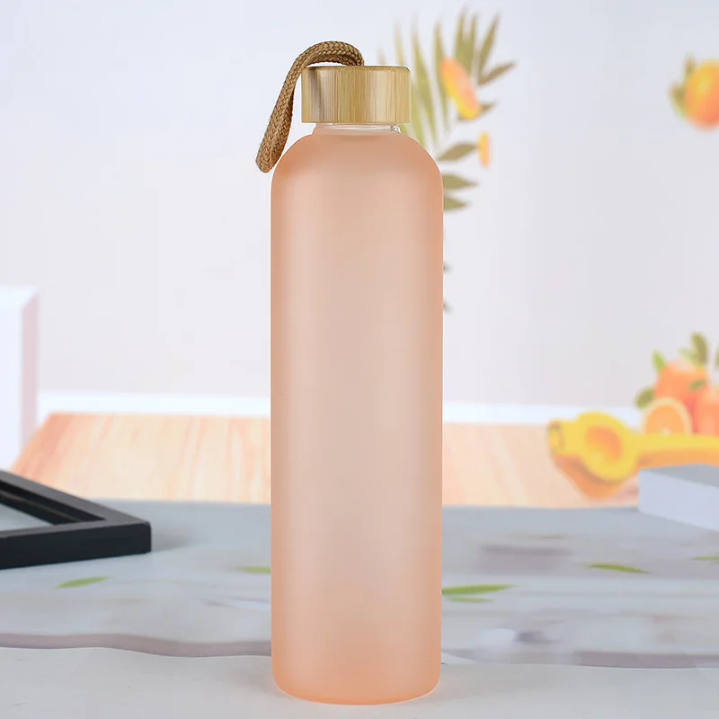 

Eco-Friendly Reusable 32 oz Glass Water Bottle with Nylon Protection Sleeves Bamboo Lid And 1L Time Marked Measurements