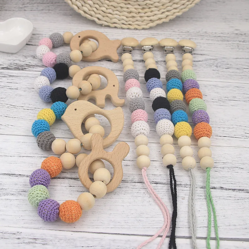 

Wholesales DIY Baby Crochet Wooden Beads Teether Bracelet With Animal Pendant Infant Teething Wooden Pacifier Clips